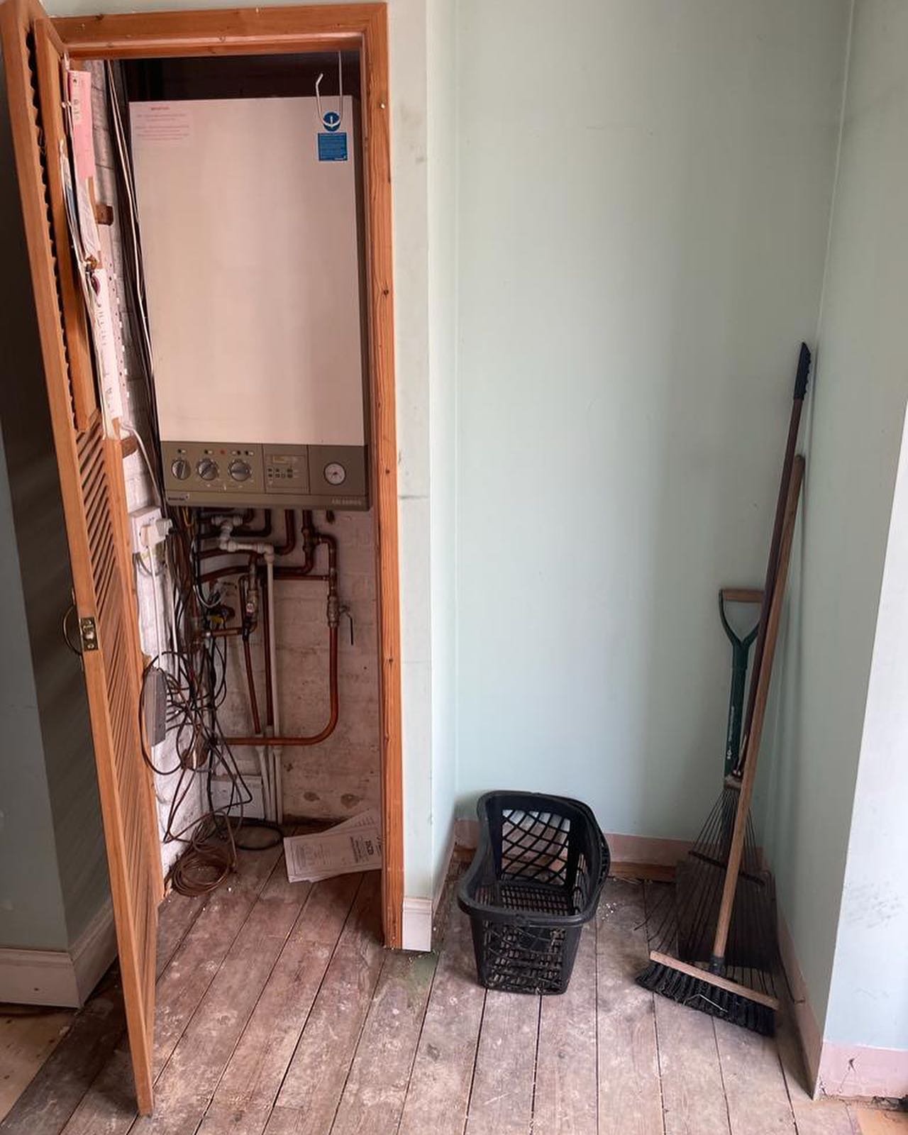 Boiler repair in a cupboard