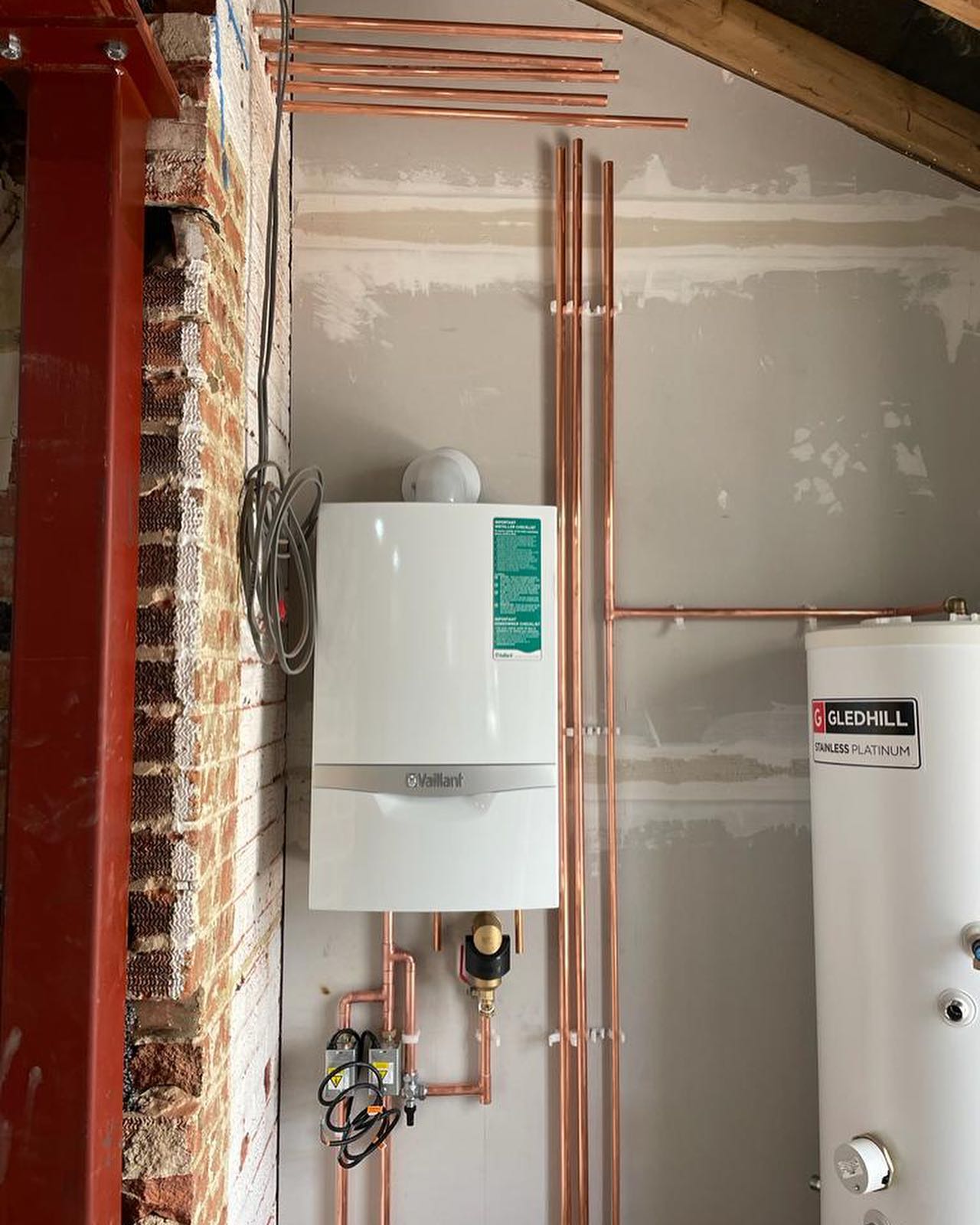 Cylinder and heating system installation with neat pipework